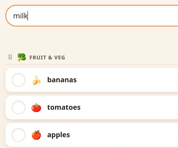 The Groceries list on the kitchen Hub, with milk typed into the add box above bananas, tomatoes and apples